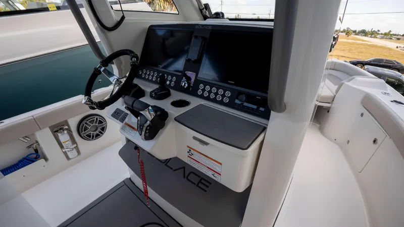 Slide: The Image of Helm of 2025 Solace 28 HCS boat with modern controls and navigation screens. - 9