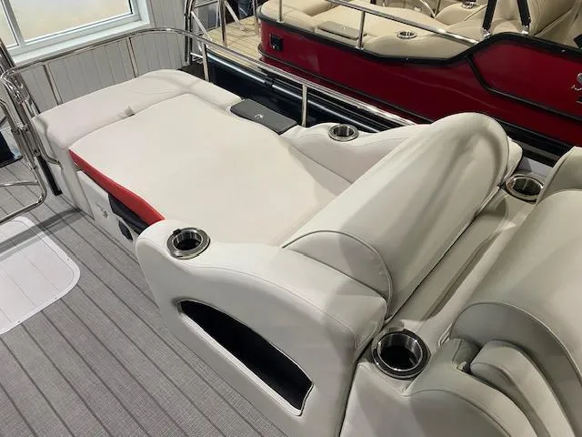 Slide: The Image of 2025 SunCatcher Elite 326 SS boat interior with luxurious seating and cup holders. - 10