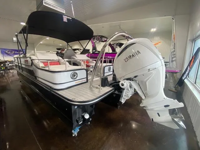 Slide: The Image of 2025 SunCatcher Elite 326 SS pontoon boat with Yamaha outboard motor in showroom. - 3