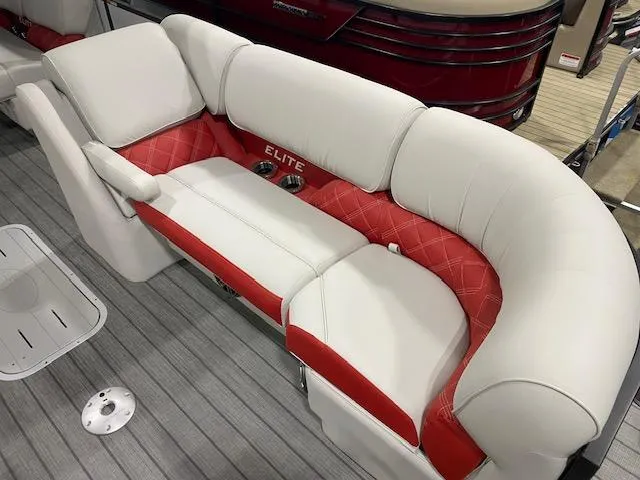 Slide: The Image of Luxurious seating on 2025 SunCatcher Elite 326 SS boat, featuring white and red upholstery. - 8