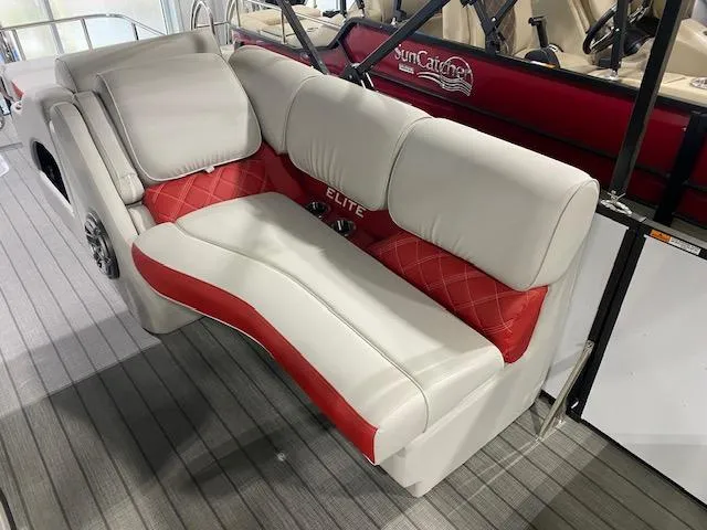 Slide: The Image of 2025 SunCatcher Elite 326 SS boat interior with red and white seating. - 9