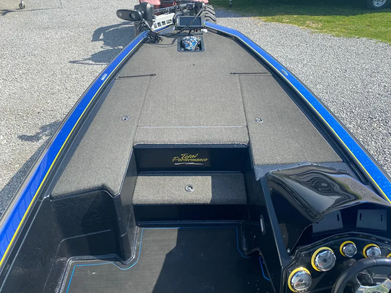 Slide: The Image of 2013 Bullet 21XRD boat interior with gray carpet and control panel. - 9