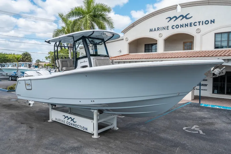 Slide: The Image of 2025 Sea Hunt Gamefish 28 CB boat displayed at Marine Connection dealership. - 8