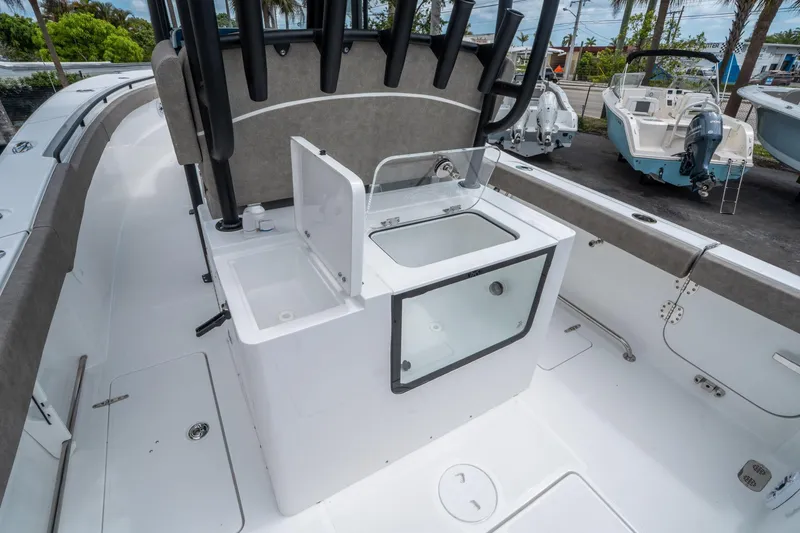 Slide: The Image of 2025 Sea Hunt Gamefish 28 CB boat interior with storage compartments and seating. - 15