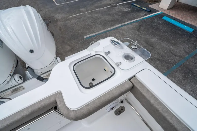 Slide: The Image of 2025 Sea Hunt Gamefish 28 CB boat with fishing station and dual outboard motors. - 14