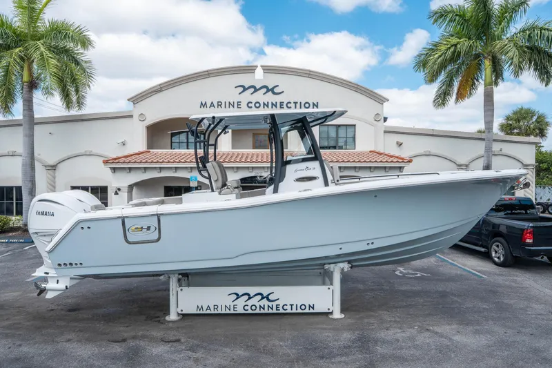 Slide: The Image of 2025 Sea Hunt Gamefish 28 CB boat displayed at Marine Connection dealership. - 1