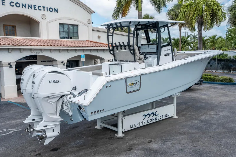 Slide: The Image of 2025 Sea Hunt Gamefish 28 CB boat with twin Yamaha engines at Marine Connection. - 2