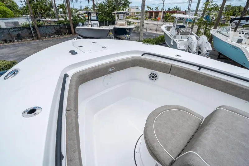Slide: The Image of 2025 Sea Hunt Gamefish 28 CB boat interior with cushioned seating and sleek design. - 26