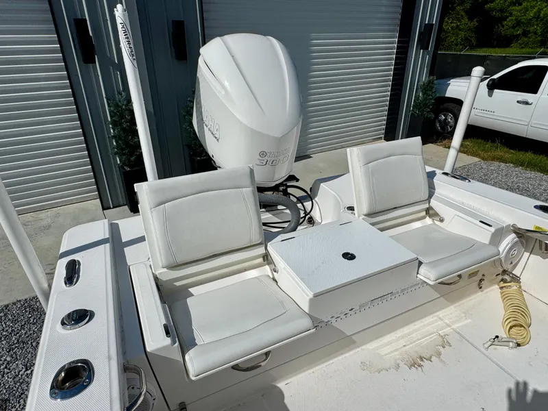 Slide: The Image of 2019 Everglades 253CC boat with dual white seats and Yamaha outboard motor. - 8