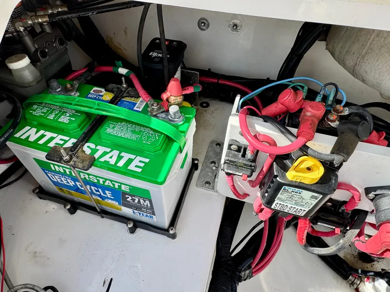 Slide: The Image of Battery compartment of a 2019 Everglades 253CC boat with Interstate deep cycle battery. - 9