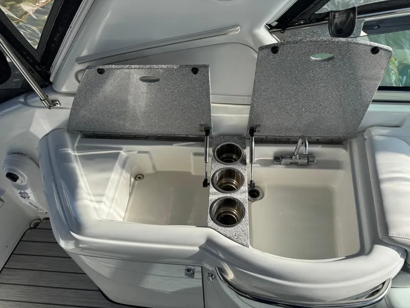 Slide: The Image of 2007 Formula 330 SS boat sink with cup holders and storage compartments. - 10