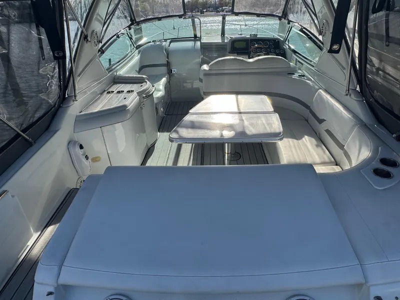 Slide: The Image of 2007 Formula 330 SS boat interior with seating and table, featuring sleek design and spacious layout. - 12