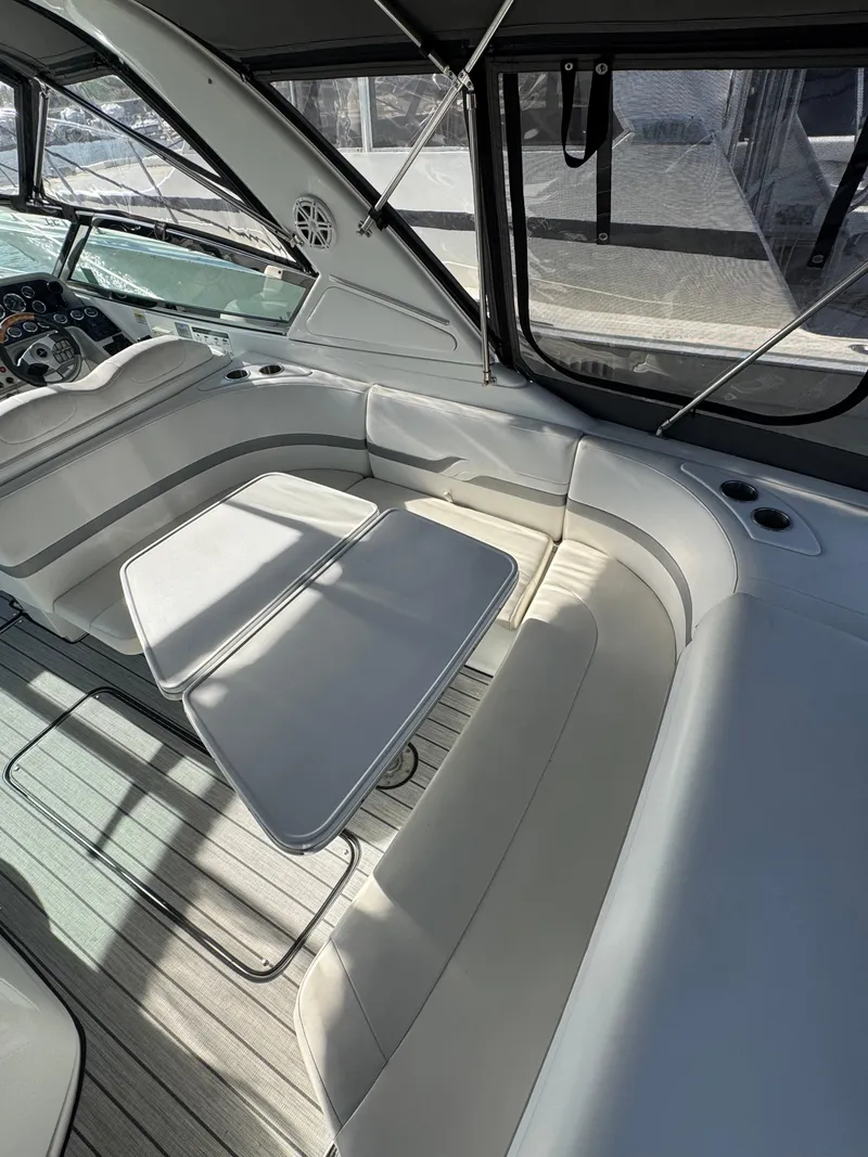 Slide: The Image of 2007 Formula 330 SS boat interior with seating and table, featuring sleek design and ample space. - 16