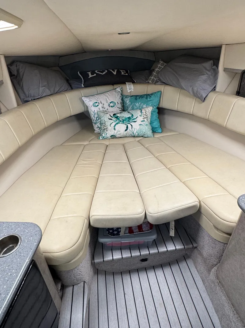 Slide: The Image of Interior of 2007 Formula 330 SS boat with cozy seating and decorative pillows. - 19