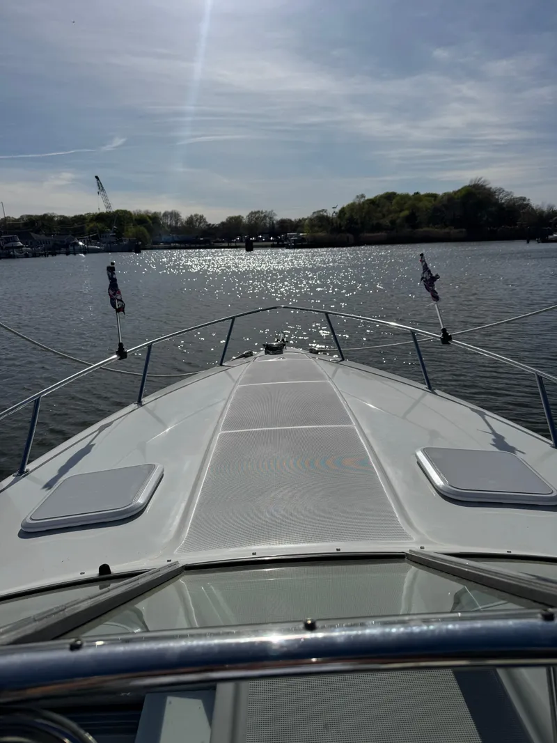 Slide: The Image of 2007 Formula 330 SS boat cruising on a sunny lake. - 2