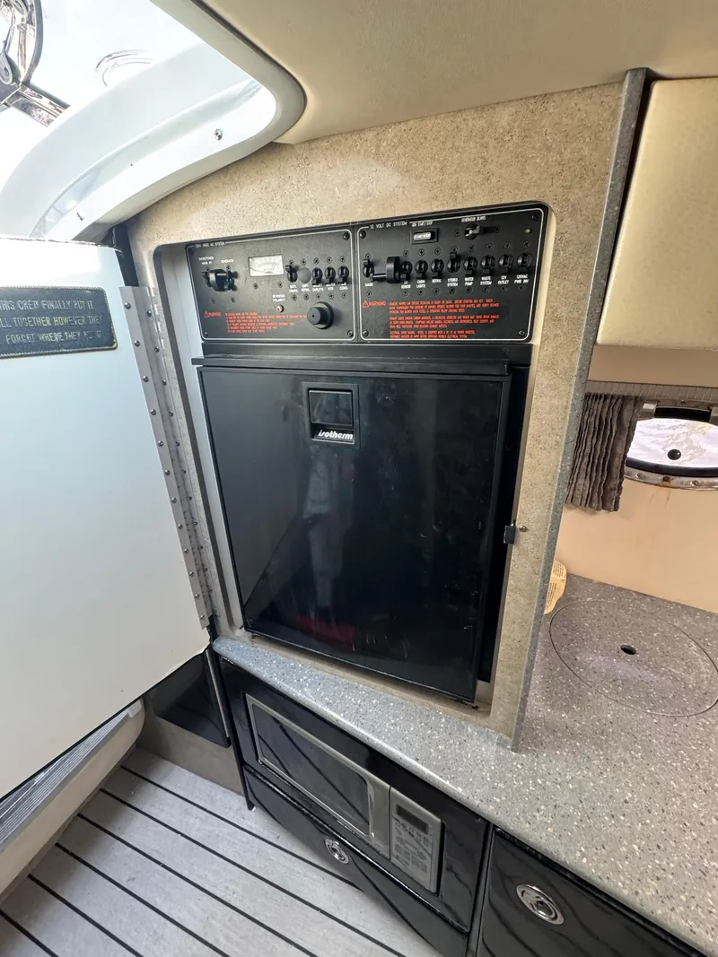 Slide: The Image of 2007 Formula 330 SS interior control panel and cabinetry. - 21