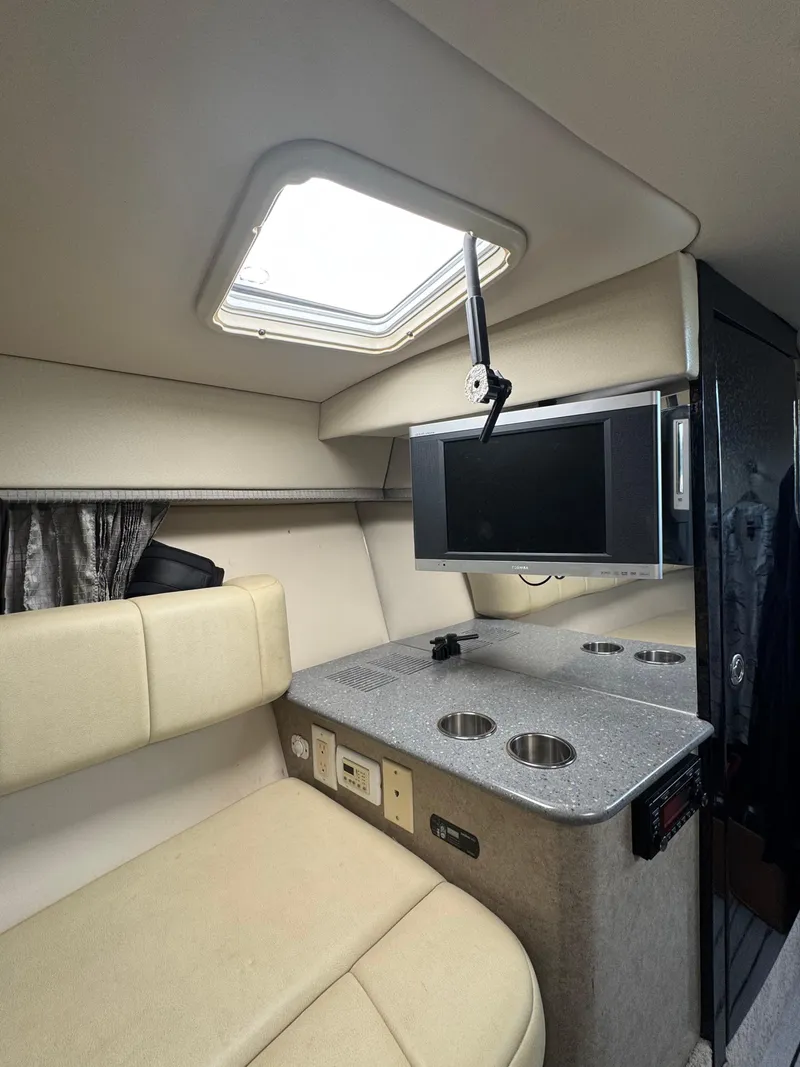 Slide: The Image of Interior of 2007 Formula 330 SS boat with seating, TV, and countertop. - 23
