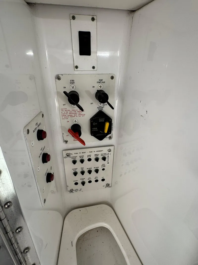 Slide: The Image of Control panel inside 2007 Formula 330 SS boat, featuring switches and dials. - 27
