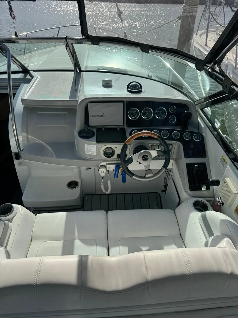 Slide: The Image of 2007 Formula 330 SS boat cockpit with steering wheel and control panel. - 3