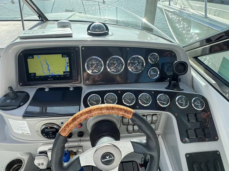 Slide: The Image of Dashboard of a 2007 Formula 330 SS boat with navigation system and gauges. - 4