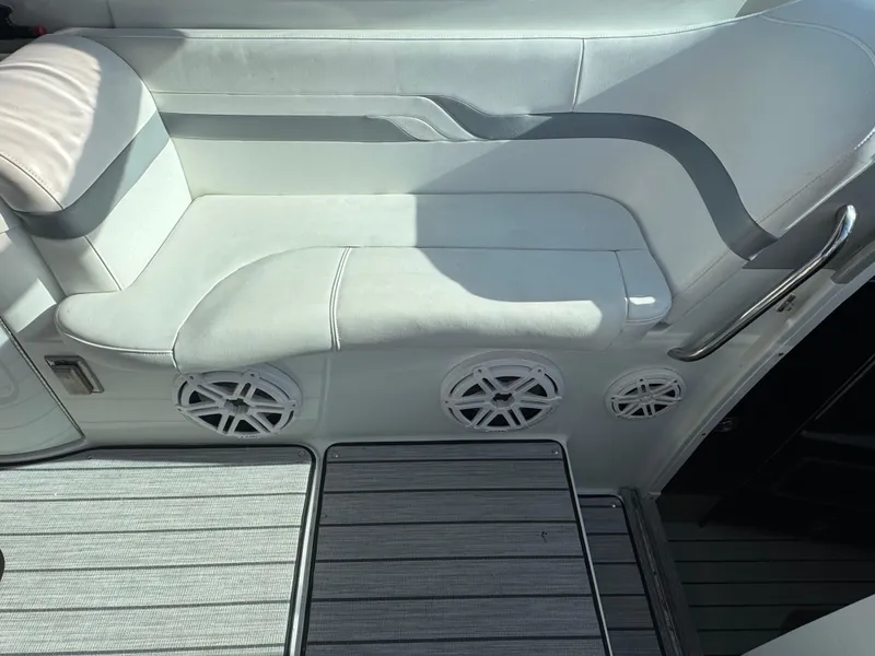 Slide: The Image of White leather seating on a 2007 Formula 330 SS boat with built-in speakers. - 5