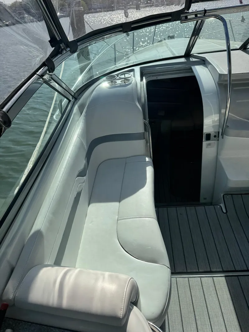 Slide: The Image of 2007 Formula 330 SS boat interior with cushioned seating and sleek design. - 6