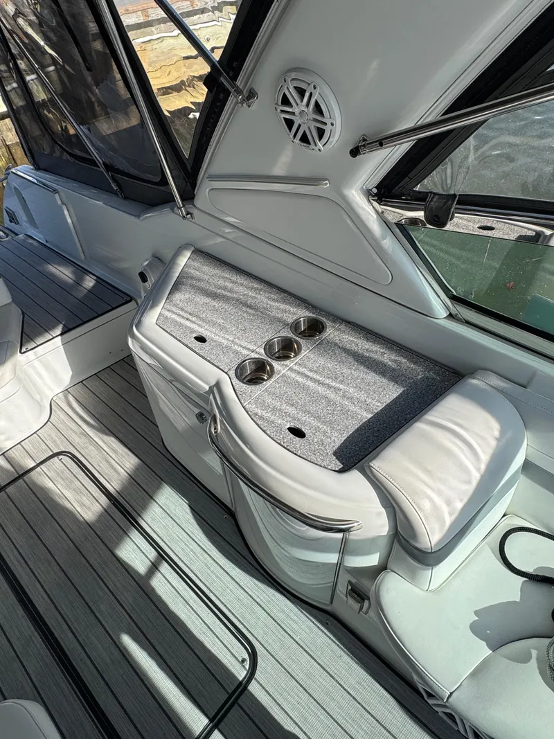 Slide: The Image of 2007 Formula 330 SS boat interior with seating and cup holders. - 7