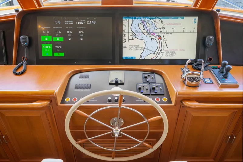 Slide: The Image of Helm of 2006 Fleming 75 yacht with navigation screens and steering wheel. - 17