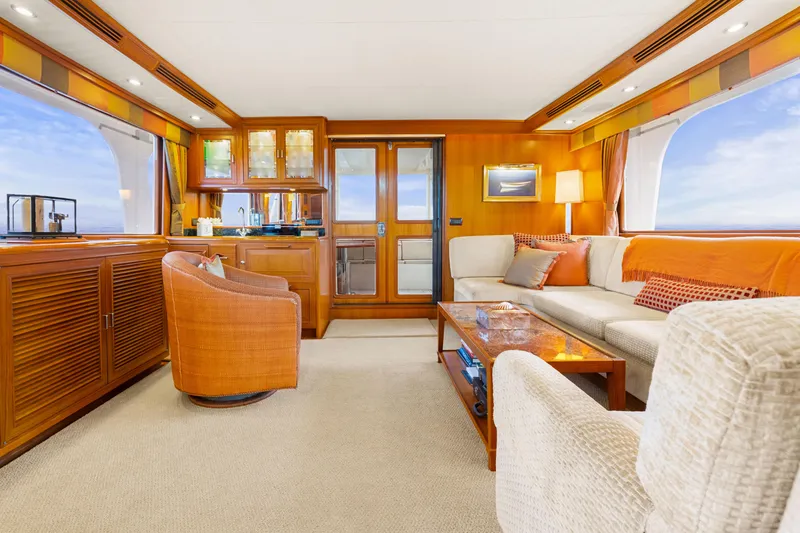 Slide: The Image of Luxurious interior of a 2006 Fleming 75 yacht with elegant seating and wooden accents. - 2