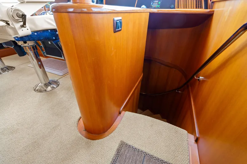 Slide: The Image of Interior of 2006 Fleming 75 yacht showing wooden staircase and seating area. - 23