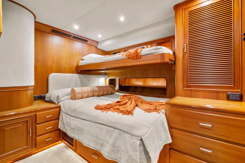 Slide: The Image of Luxurious cabin interior of 2006 Fleming 75 yacht with wooden furnishings and cozy bedding. - 30