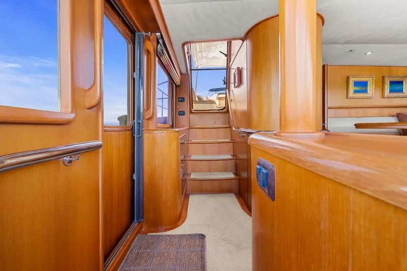 Slide: The Image of Interior of 2006 Fleming 75 yacht with wooden finishes and staircase. - 36