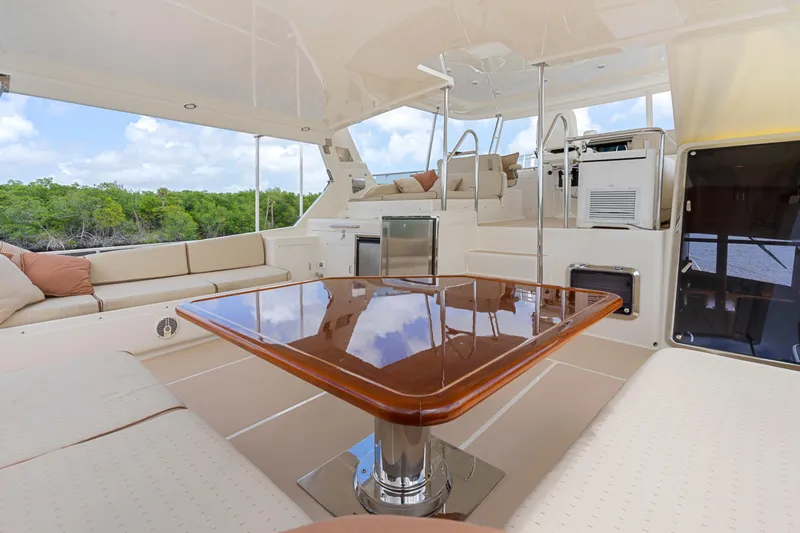 Slide: The Image of Luxurious 2006 Fleming 75 yacht interior with polished wood table and comfortable seating. - 37