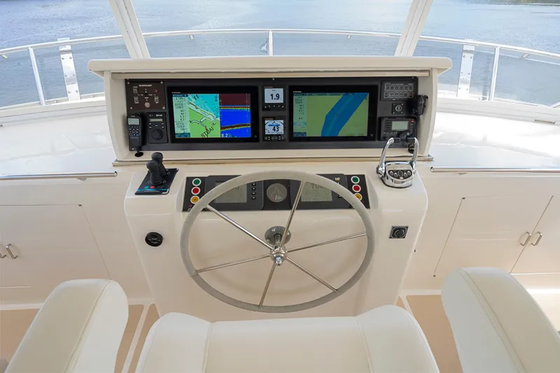 Slide: The Image of Helm of 2006 Fleming 75 yacht with navigation screens and steering wheel. - 39