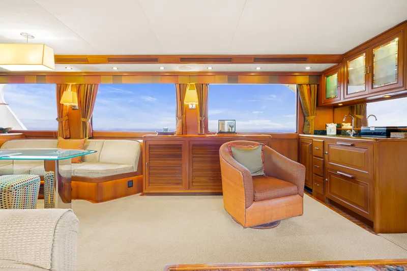 Slide: The Image of Luxurious interior of a 2006 Fleming 75 yacht with elegant wood finishes and ocean view. - 4