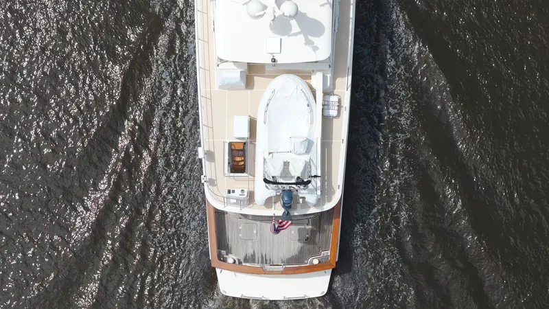 Slide: The Image of Aerial view of 2006 Fleming 75 yacht cruising on dark water. - 48