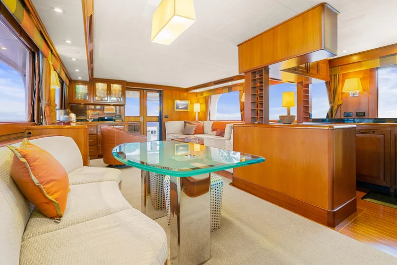 Slide: The Image of Luxurious interior of a 2006 Fleming 75 yacht with elegant wood finishes and modern furnishings. - 5