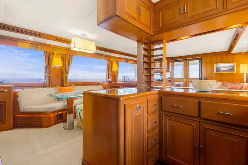 Slide: The Image of Luxurious interior of 2006 Fleming 75 yacht with elegant wood cabinetry and panoramic windows. - 7