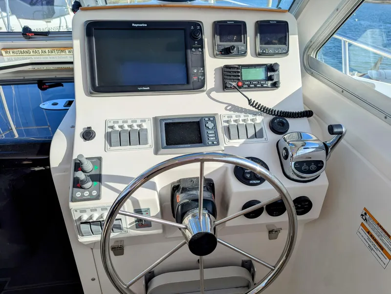 Slide: The Image of Helm of 2014 Back Cove 34 boat with navigation equipment and steering wheel. - 8