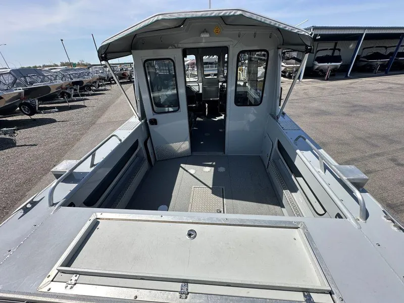 Slide: The Image of 2016 Hewescraft 220 Ocean Pro HT BH boat, spacious deck, docked outdoors. - 4