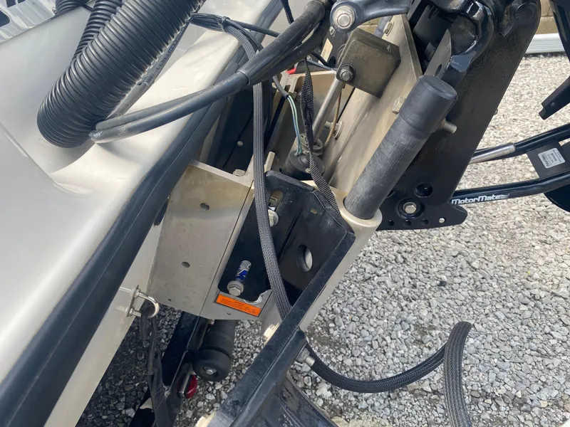 Slide: The Image of Boat engine mount and cables on a 2011 Triton 21 HP SC. - 10