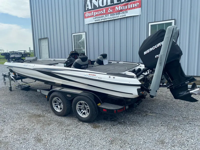 Slide: The Image of 2011 Triton 21 HP SC boat with Mercury engine, parked outside Angler's Outpost & Marine. - 11