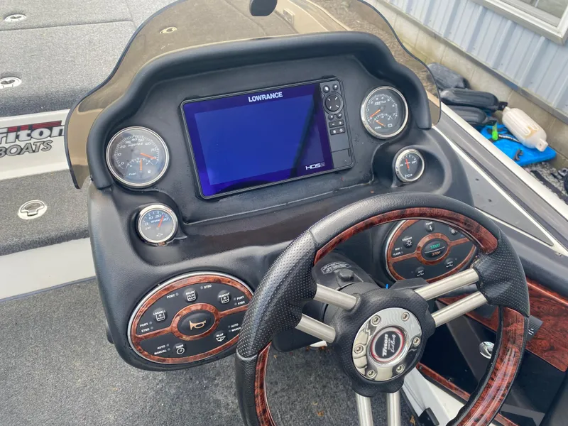 Slide: The Image of Dashboard of a 2011 Triton 21 HP SC boat with Lowrance display and gauges. - 12