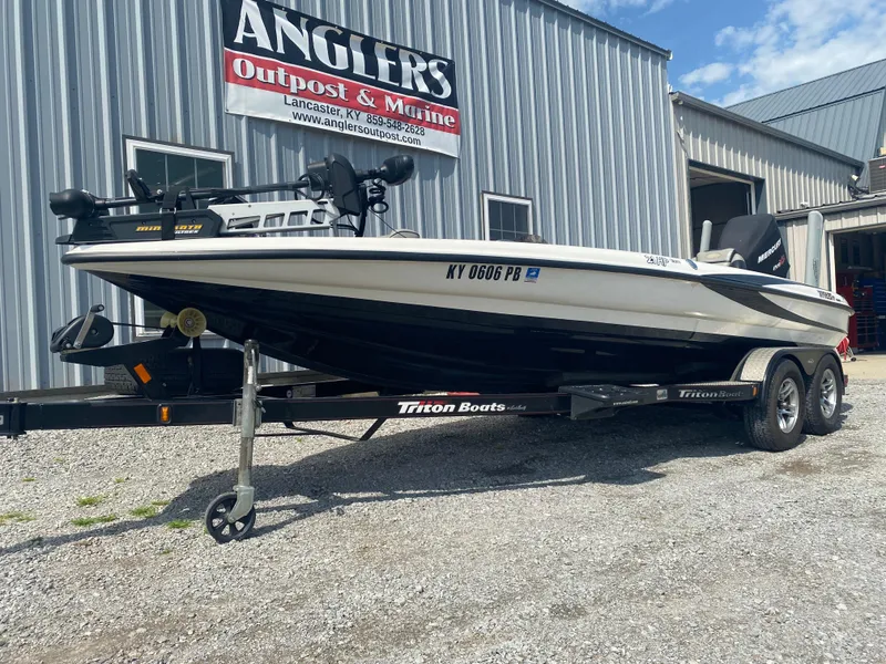 Slide: The Image of 2011 Triton 21 HP SC boat on trailer at Angler's Outpost & Marine. - 4
