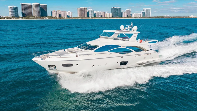 Slide: The Image of Luxurious 2010 Azimut 95 yacht cruising on blue ocean near city skyline. - 1