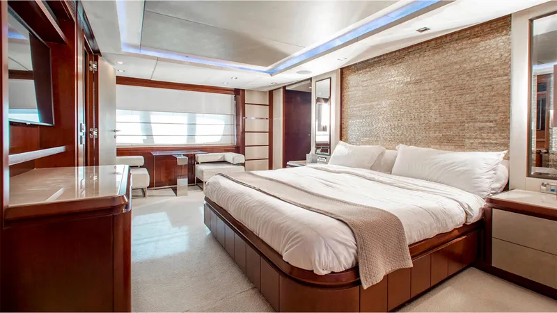 Slide: The Image of Luxurious bedroom interior of 2010 Azimut 95 yacht with elegant furnishings and ambient lighting. - 17