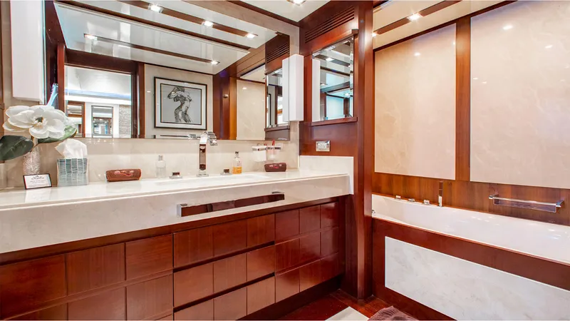 Slide: The Image of Luxurious bathroom in 2010 Azimut 95 yacht, featuring elegant wood and marble finishes. - 19