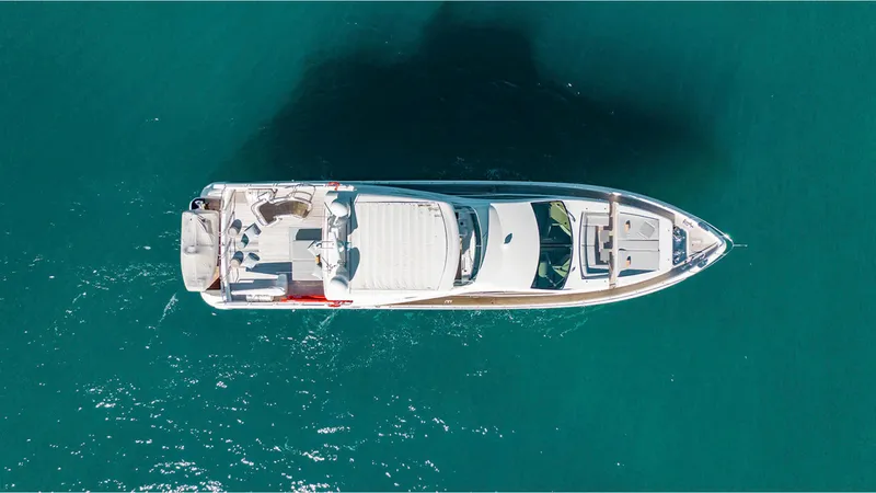 Slide: The Image of Overhead view of a 2010 Azimut 95 yacht on clear blue water. - 2