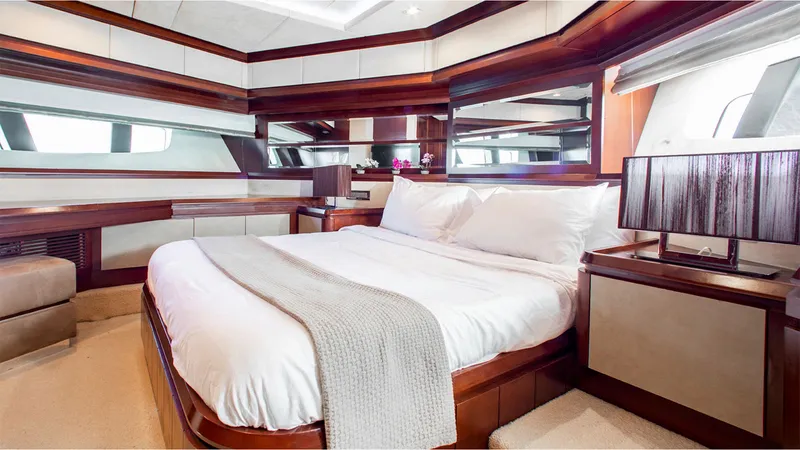 Slide: The Image of Luxurious bedroom interior of 2010 Azimut 95 yacht with elegant wood finishes and modern decor. - 20
