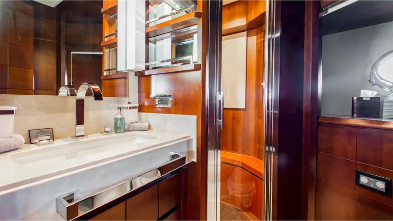 Slide: The Image of Luxurious bathroom interior on 2010 Azimut 95 yacht, featuring elegant wood finishes and modern fixtures. - 21